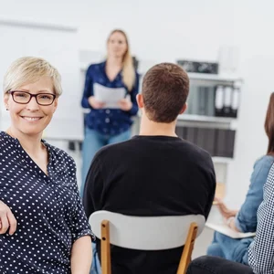 Teilnehmerin in einem Seminar